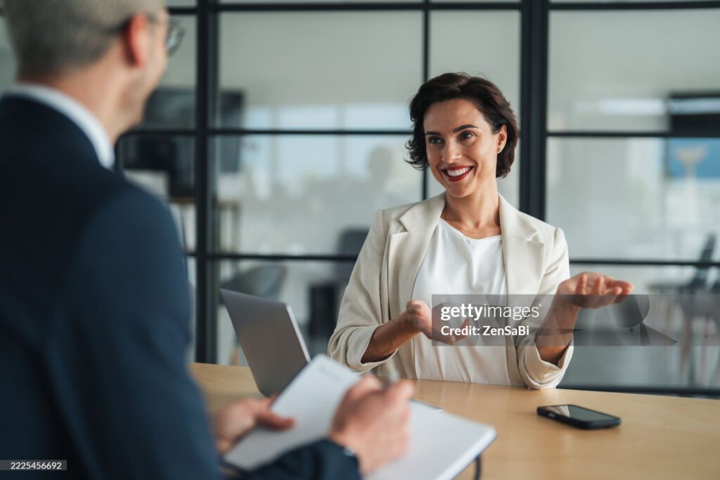 An engaged leader navigates a productive business dialogue, sharing strategic insights in a results-oriented setting. This moment captures the essence of executive alignment—where clarity of vision, mutual respect, and agile thinking fuel meaningful collaboration and forward momentum.